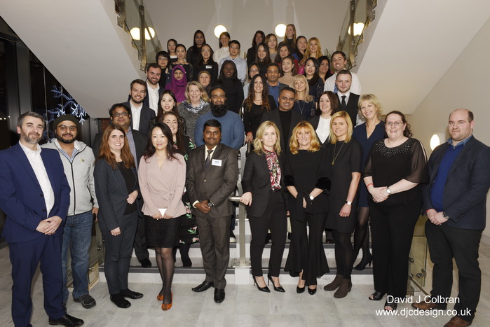 Large staff group photograph at Liverpool John Moores University