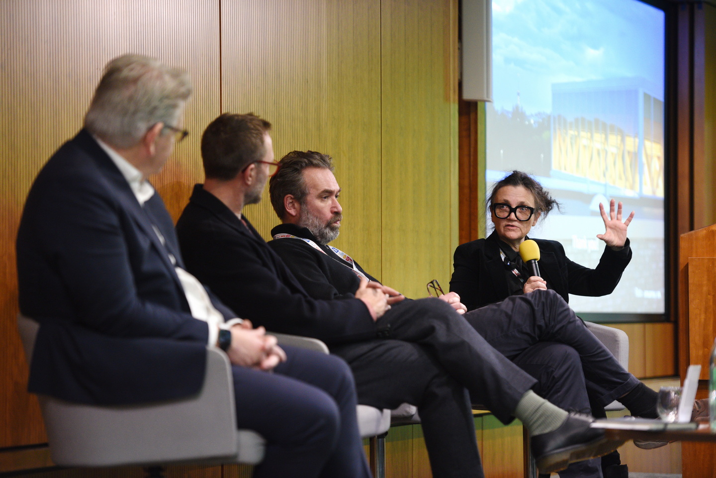 Panel discussions on stage photography at a corporate conference
