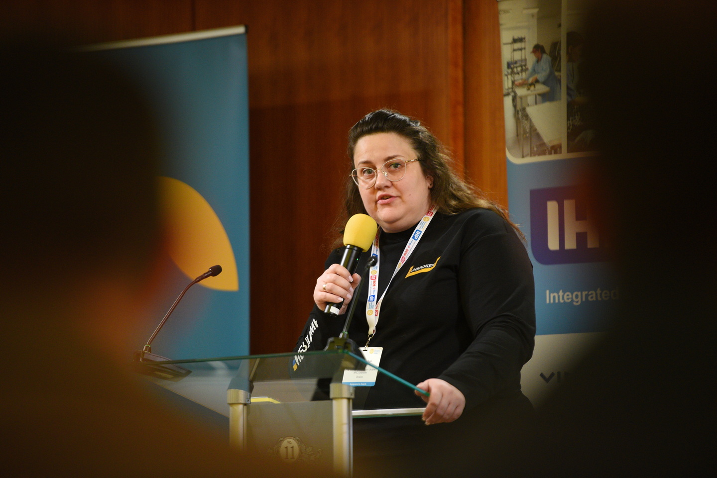Individual speaker at a lecture presenting a case study