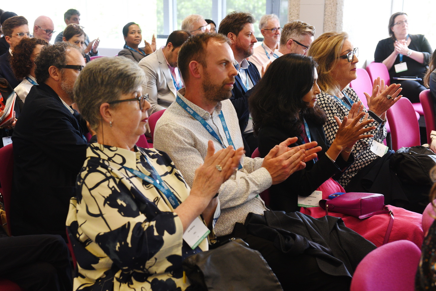 Clapping audience at conference