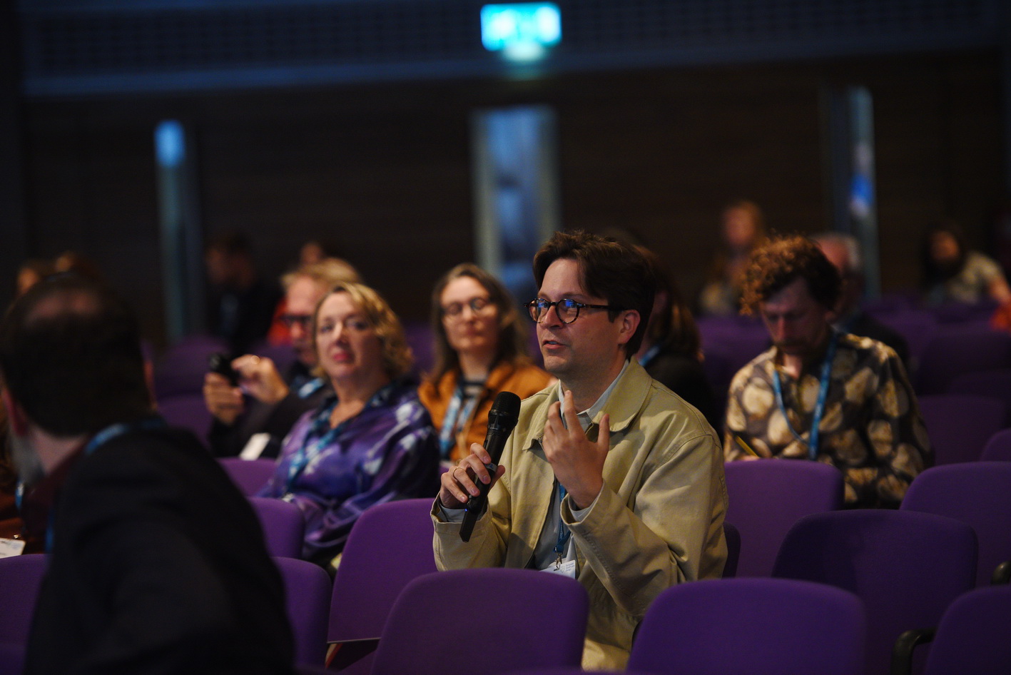 Delegates asking questions at conference