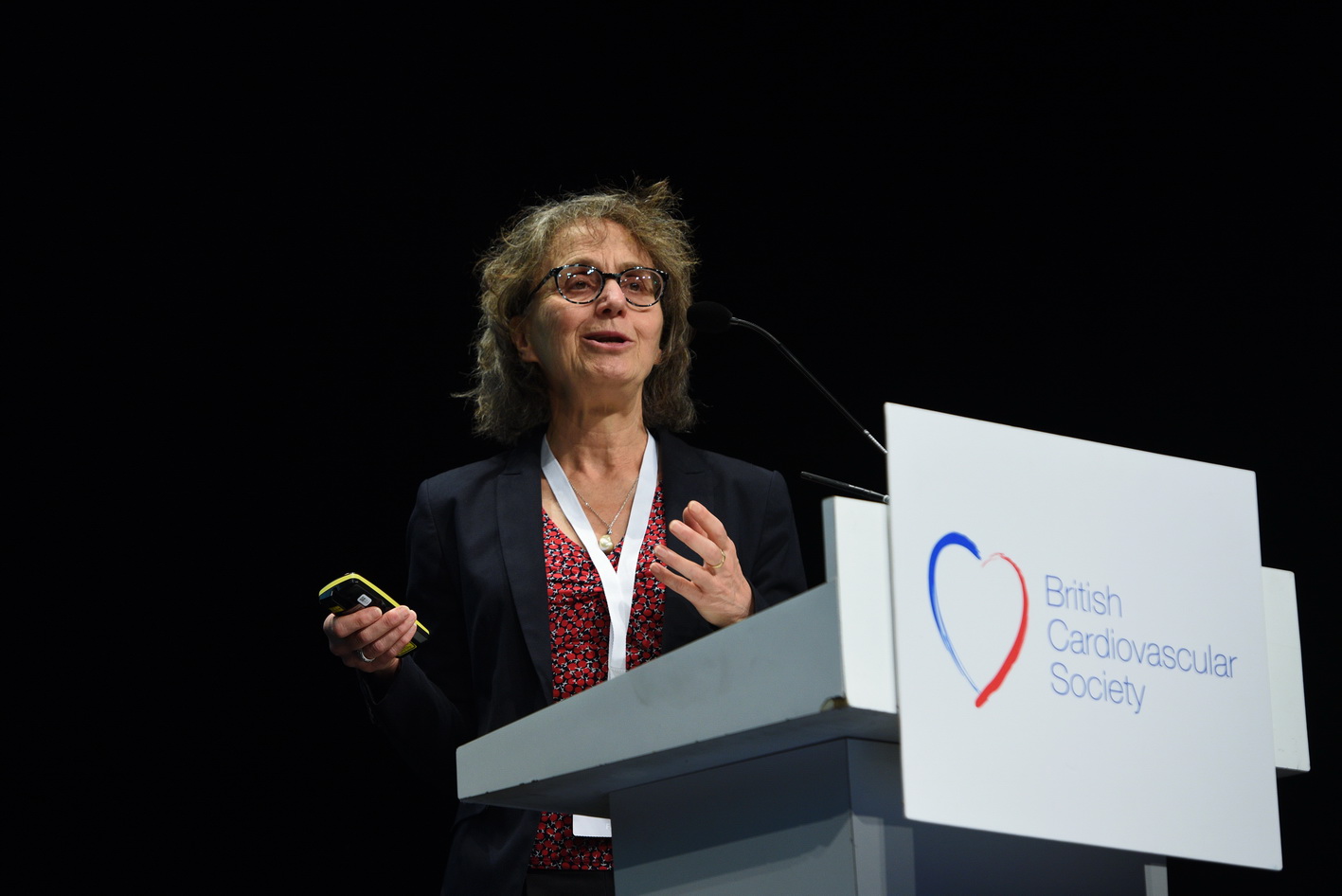 Conference speaker at professional medical event in Manchester