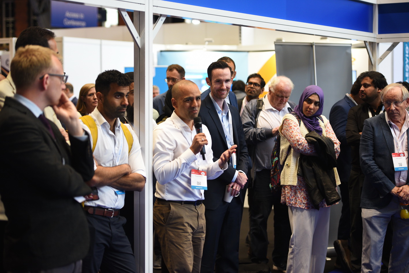 Delegate interactions at a busy conference in Manchester