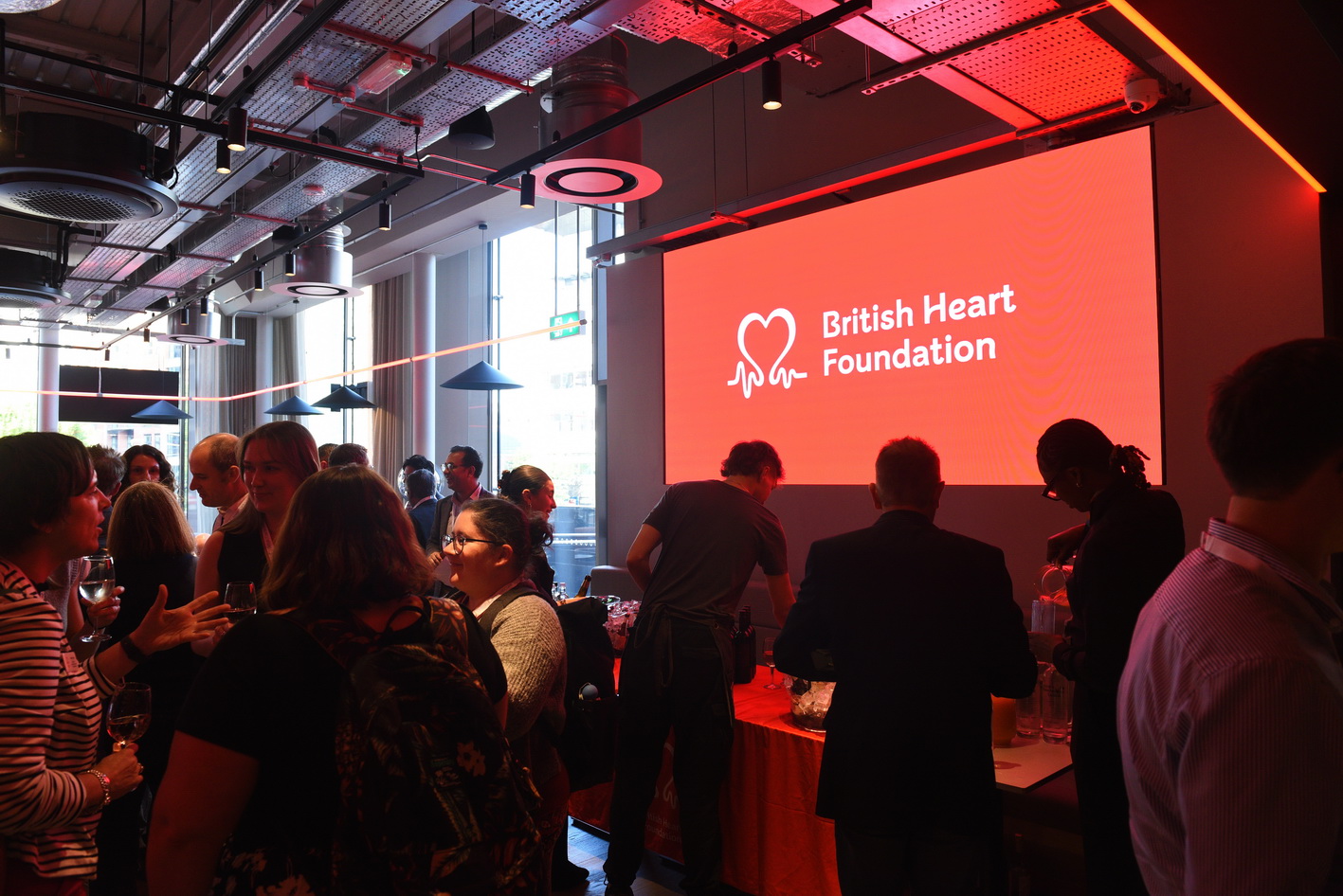 Evening event showing branding from the sponsor British Heart Foundation