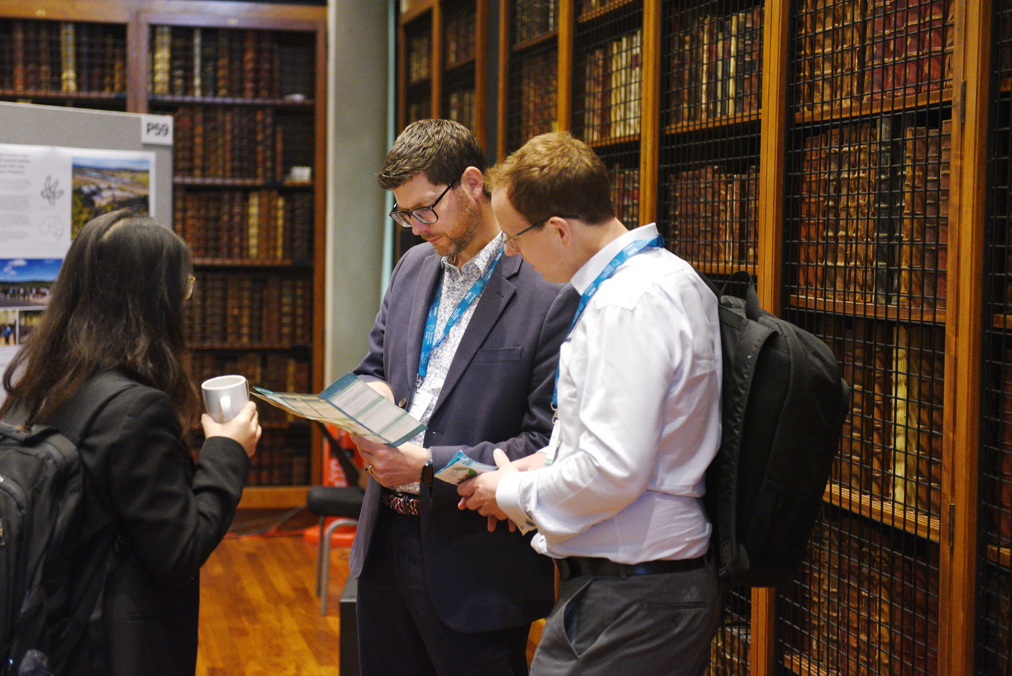 Delegate taking a photo of exhibition board presentations