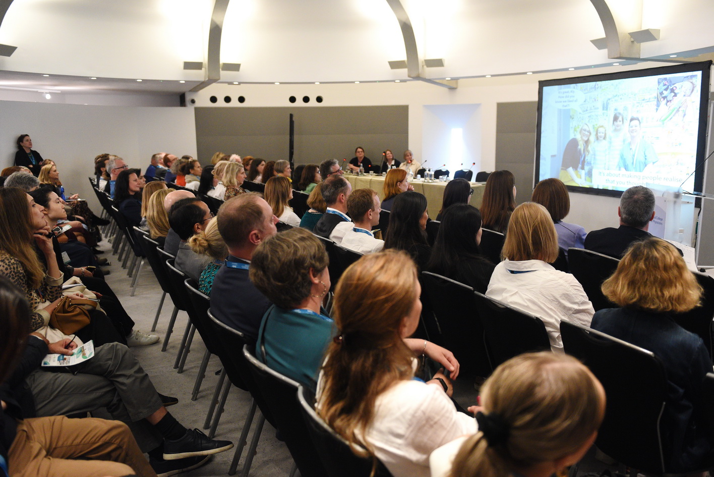 Conference photography presentation with venue branding
