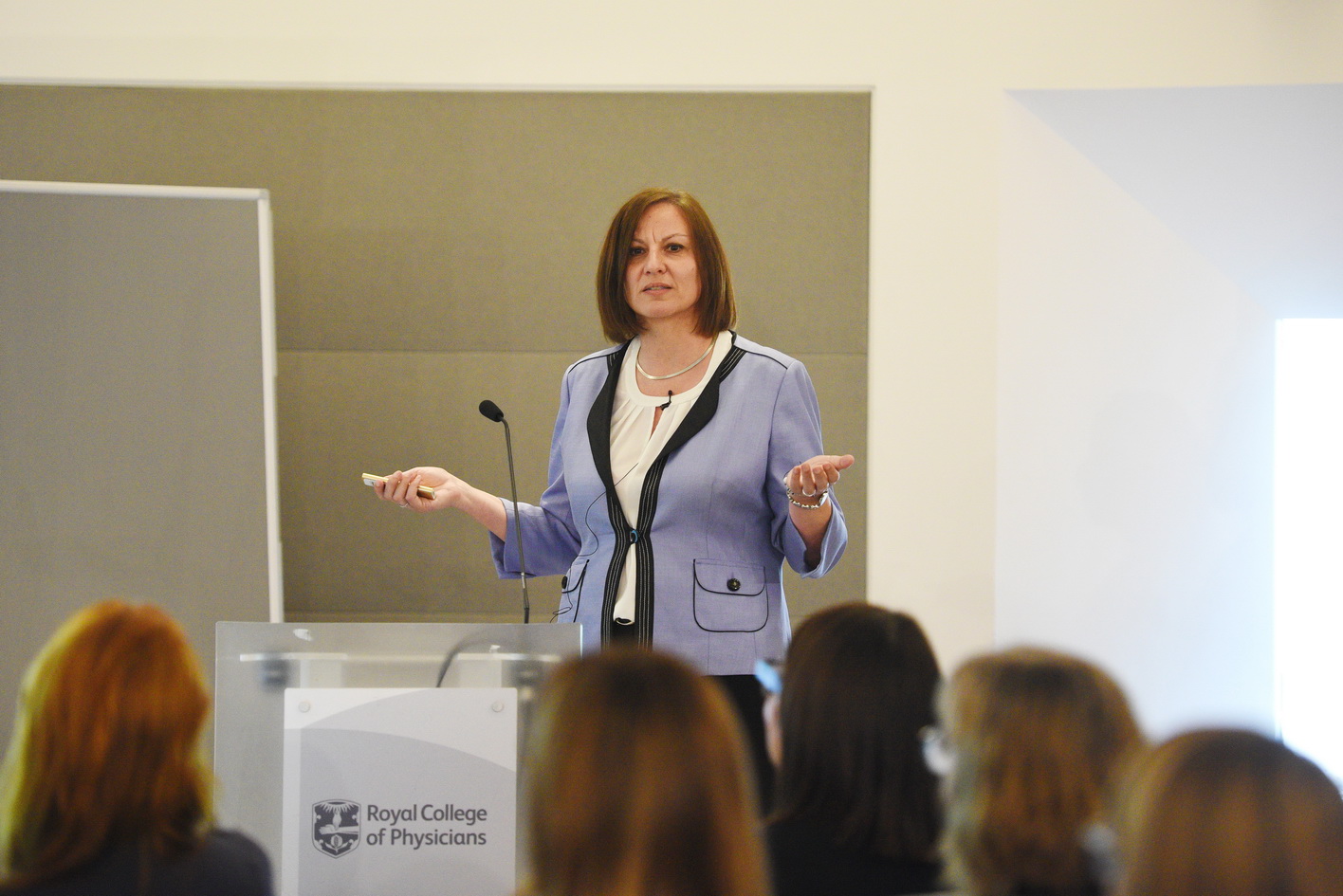 Conference photography presentation with venue branding
